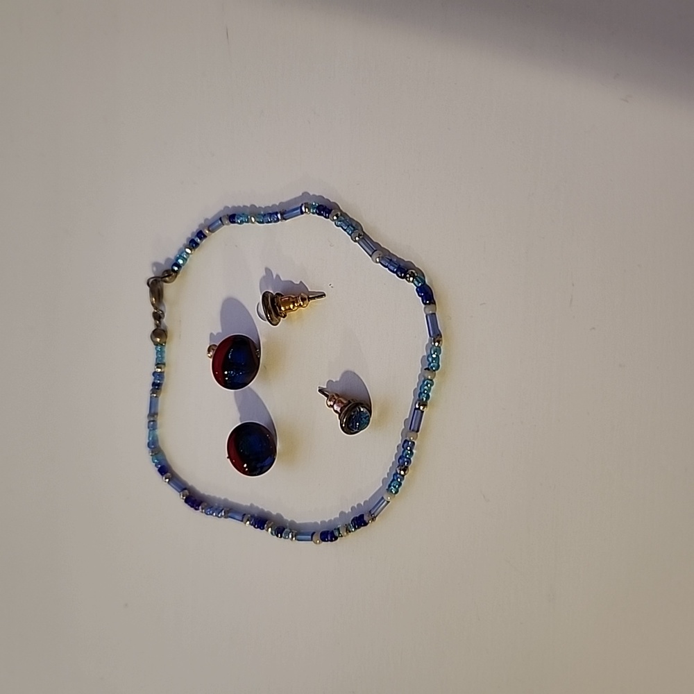 Beaded blue anklet, navy blue with red earring studs, and baby blue earring stud
